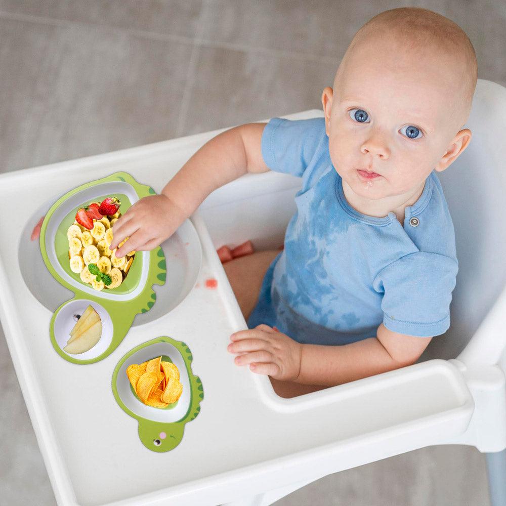 baby eating in polka tots dinner set