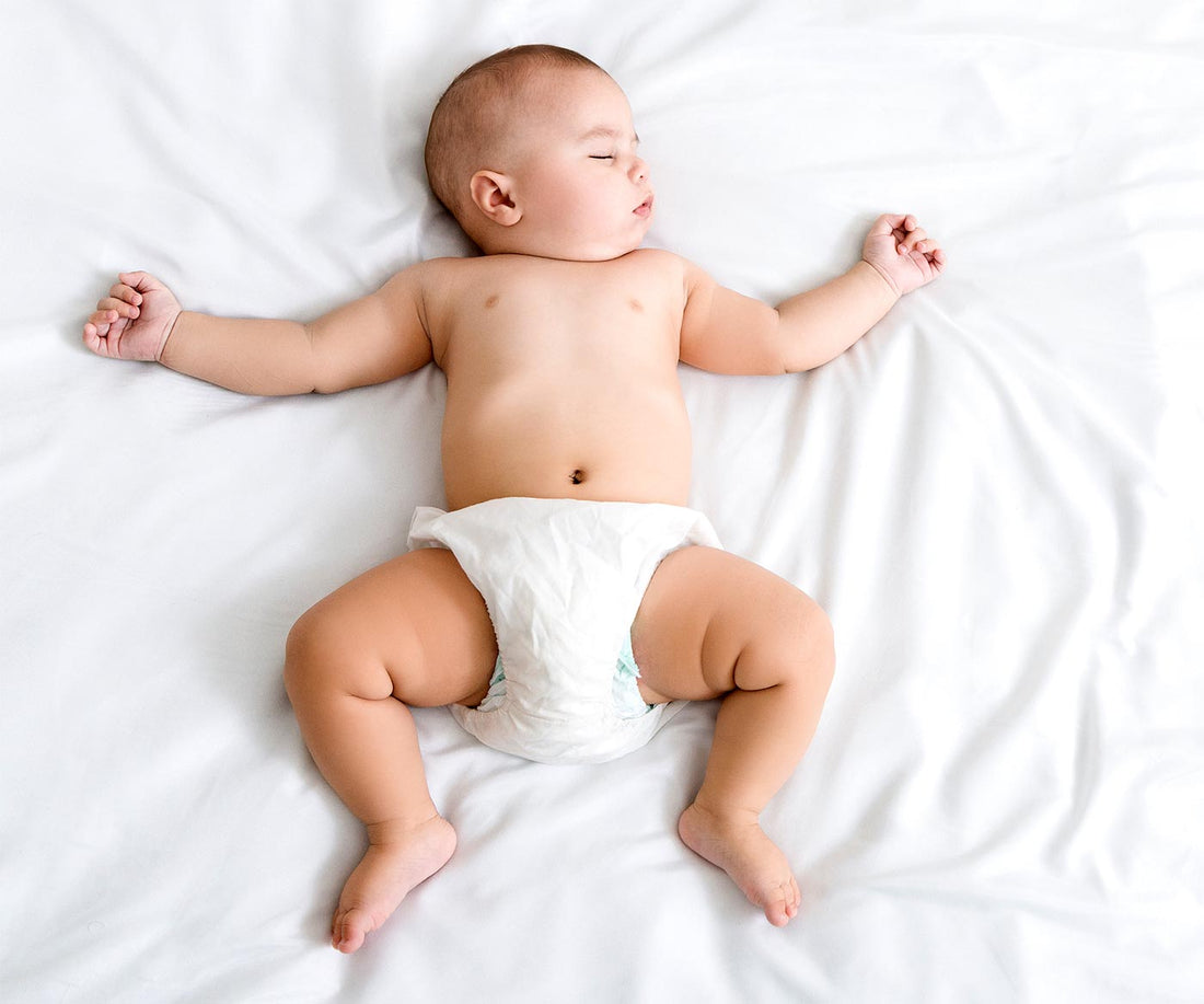 BABY Sleeping In White Diaper 