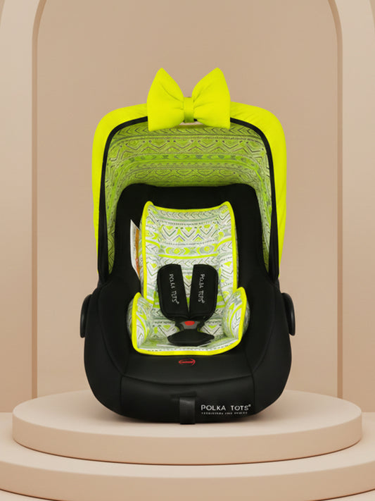 Black and yellow car seat with a bow on a beige background
