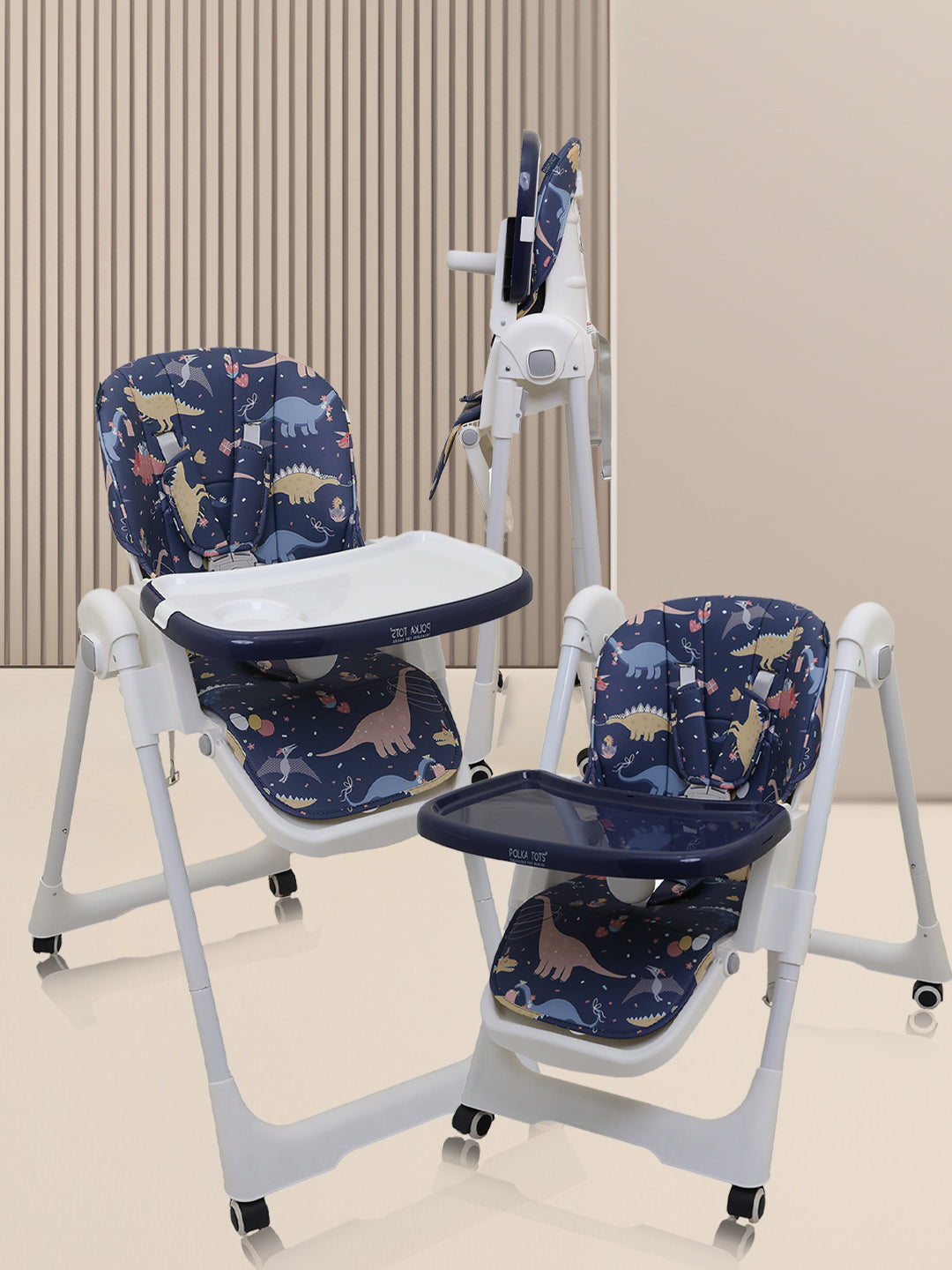Baby high chair with dinosaur pattern on a beige floor and wall background