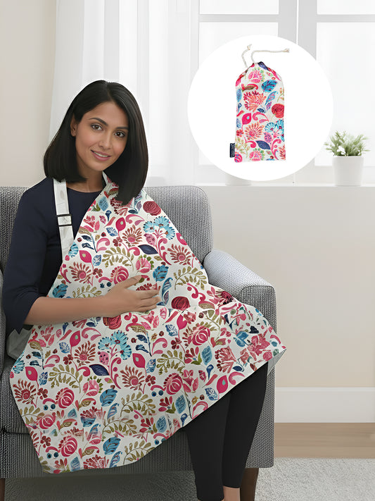 Woman wearing a floral apron sitting on a chair with a matching floral bag inset.