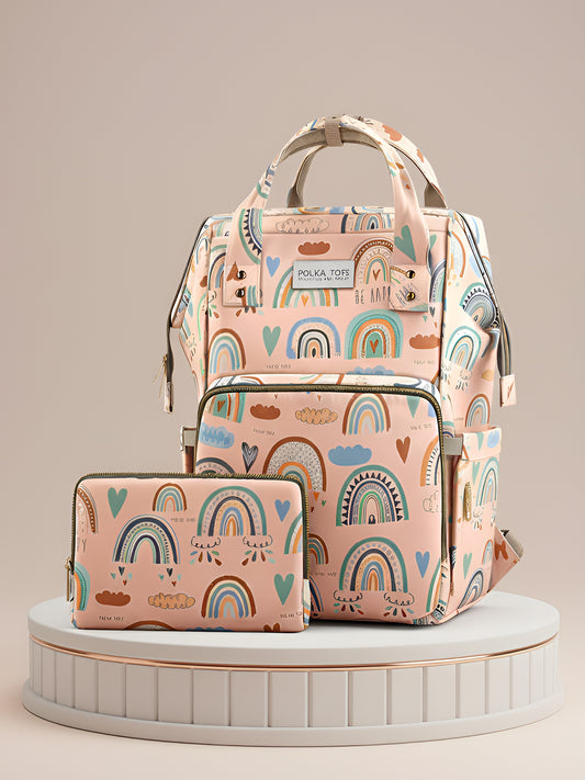 Pink diaper bag with rainbow pattern on a beige background