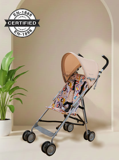 Baby stroller with patterned seat cover on a neutral background, featuring certification logo.