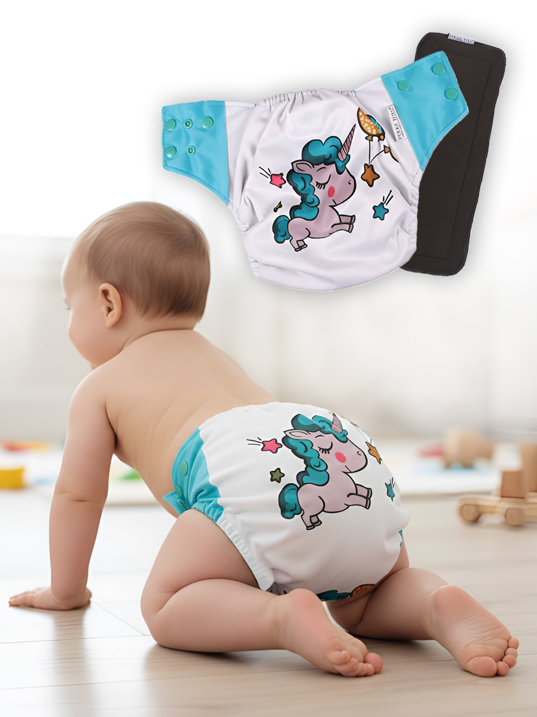Baby wearing a white diaper with cartoon design on a light wooden floor.