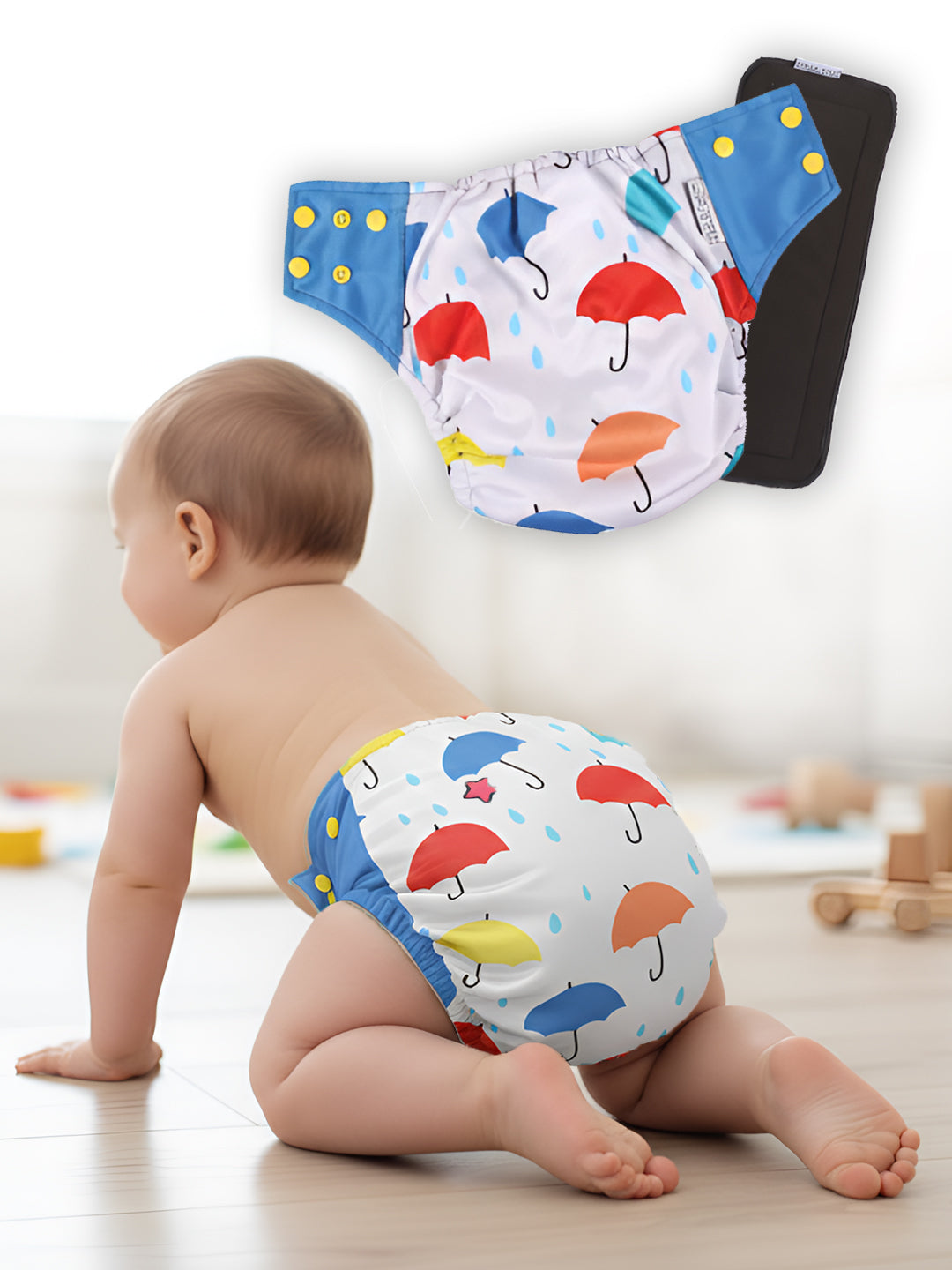 Baby wearing a colorful diaper with umbrella pattern, surrounded by additional diapers on a light background.