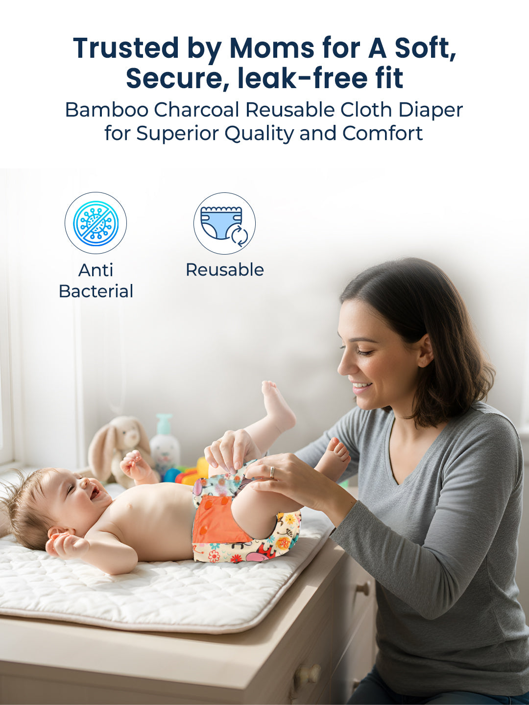 Woman changing a baby on a changing table with text about bamboo charcoal reusable cloth diapers.