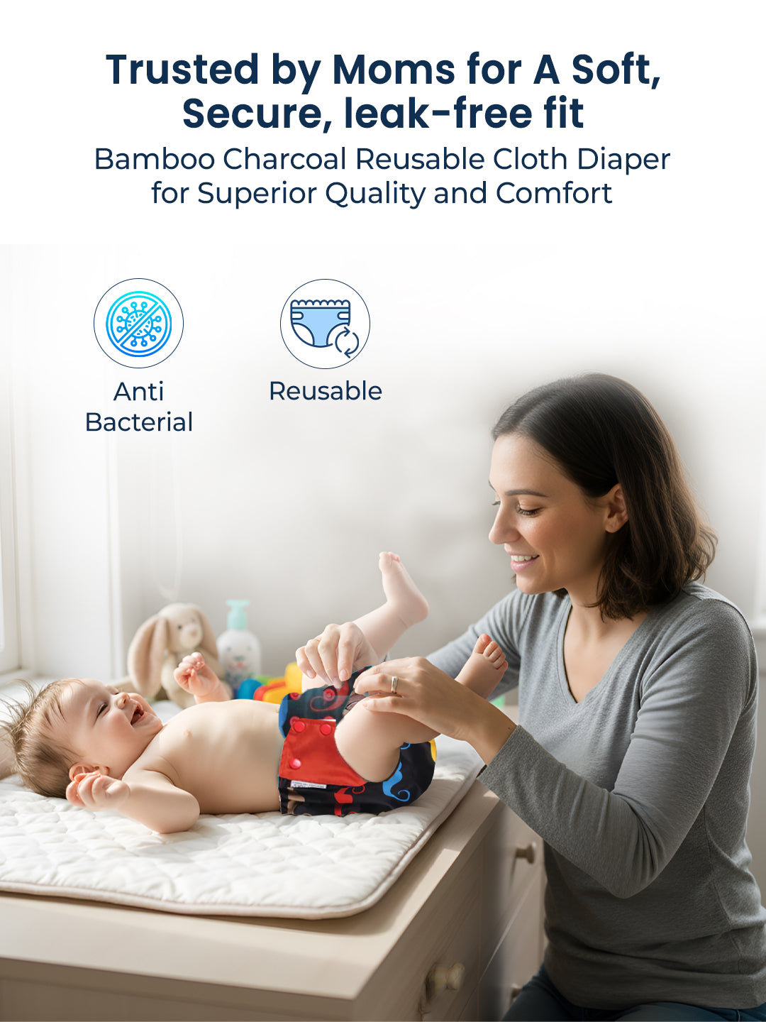 Woman changing a baby on a changing table with text about bamboo charcoal reusable cloth diapers.