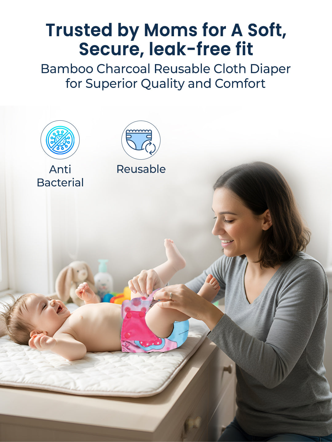Woman changing a baby's diaper with text about bamboo charcoal reusable cloth diapers.