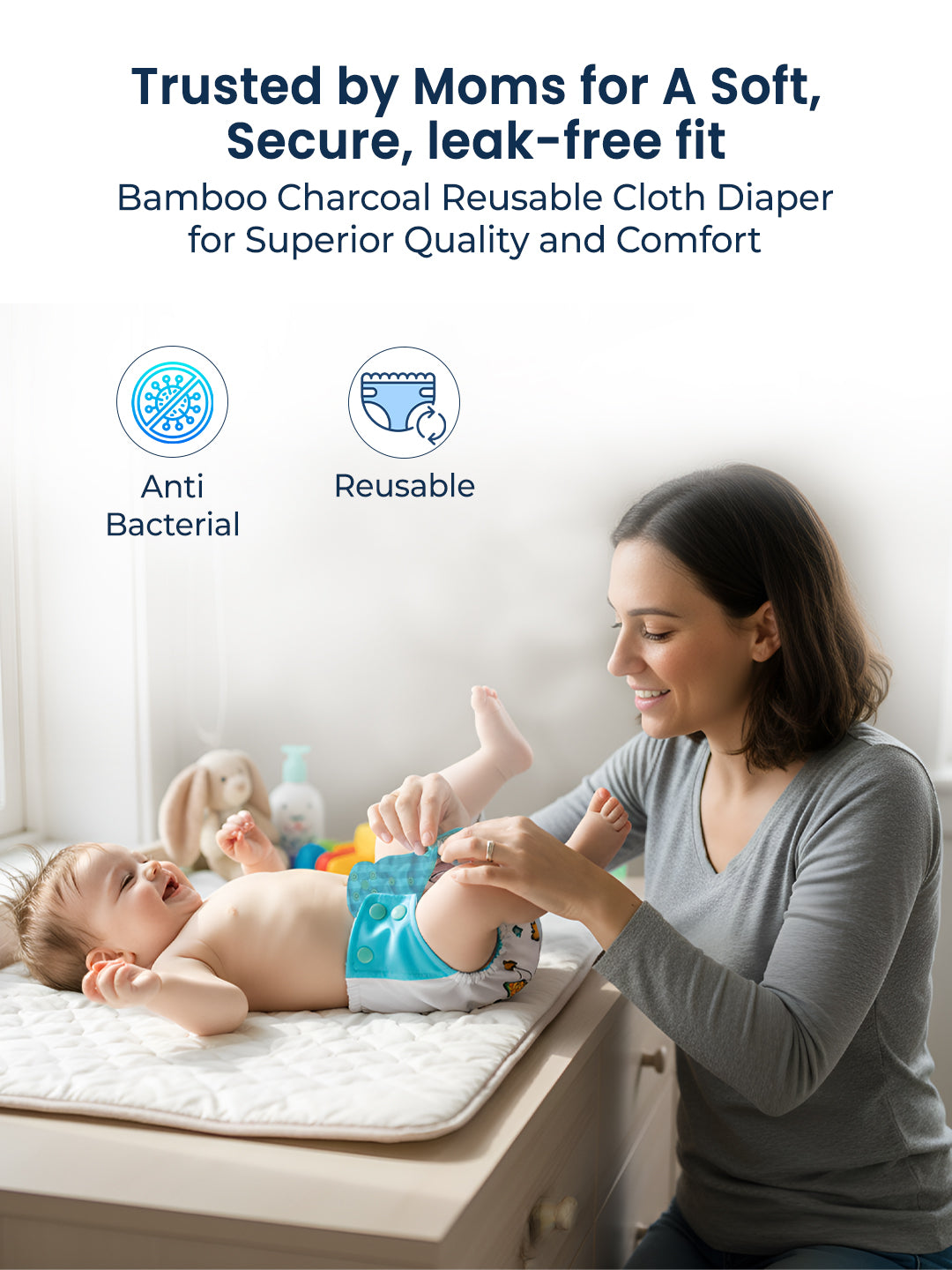 Woman changing a baby's diaper with text about bamboo charcoal reusable cloth diapers.