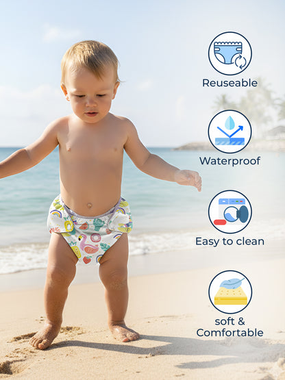 Child wearing a reusable diaper on a beach with features highlighted.