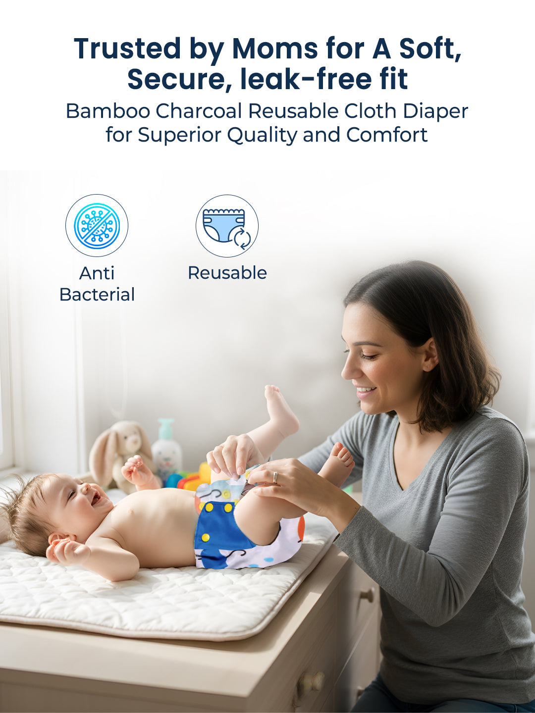 Woman changing a baby's diaper on a changing table with text about bamboo charcoal reusable cloth diapers.