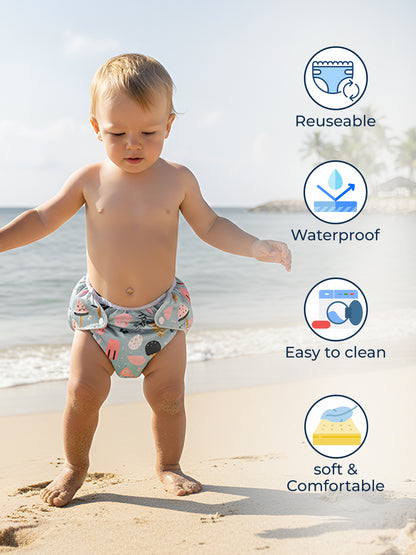 Child wearing a reusable, waterproof, easy-to-clean, and soft & comfortable diaper on a beach.