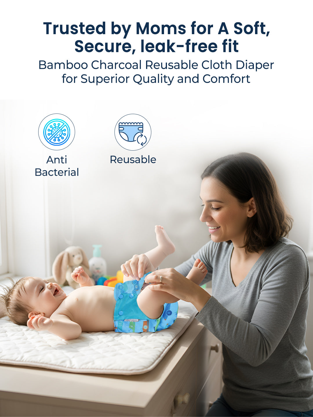 Woman changing a baby's diaper with text about bamboo charcoal reusable cloth diapers.