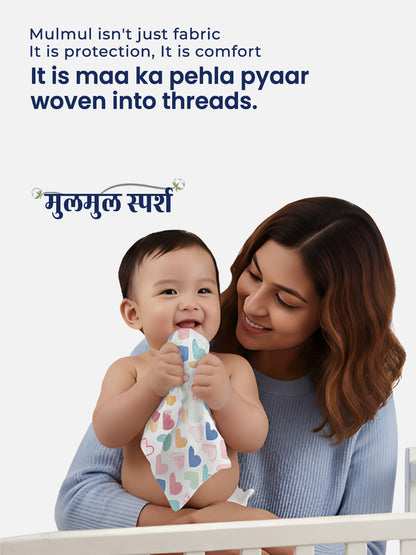 Woman holding a baby wrapped in a Mulmul fabric with text about its benefits.