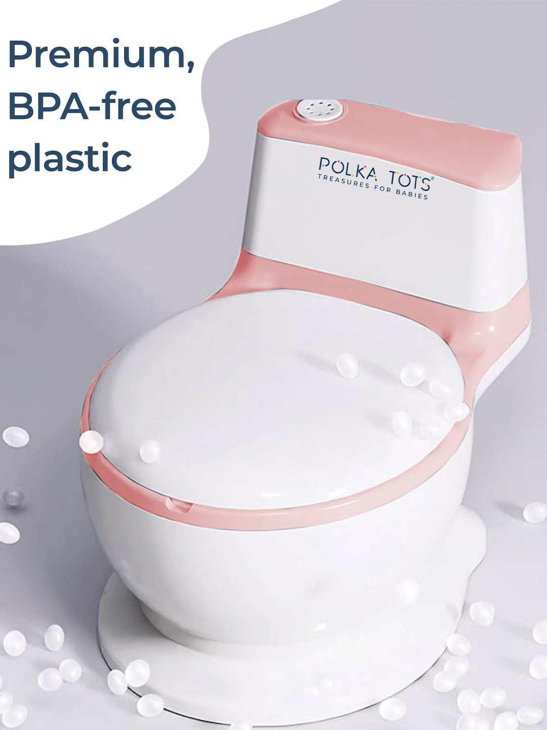 Pink and white potty chair with 'Polka Tots' branding on a light gray background.