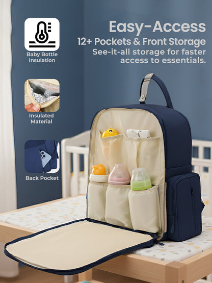 Navy blue and beige diaper bag with multiple pockets on a wooden surface.