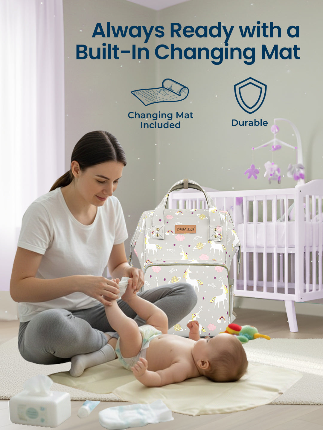 Woman changing a baby on a changing mat with text about a built-in changing mat and durable design.