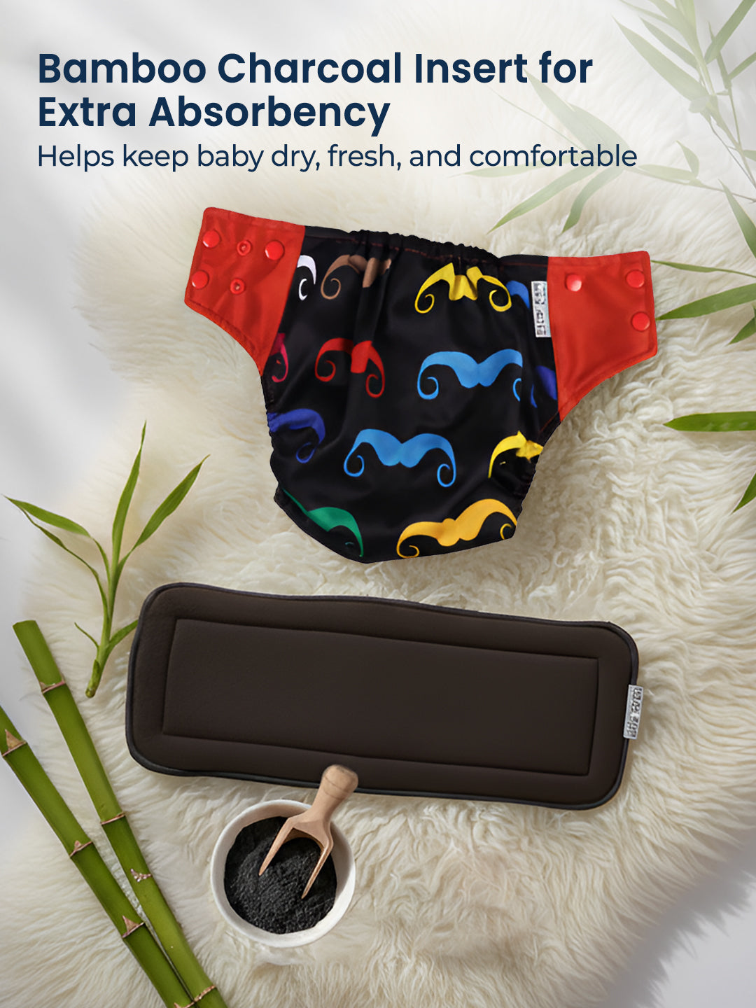 Reusable diaper with colorful mustache pattern on a textured surface with bamboo and charcoal elements.