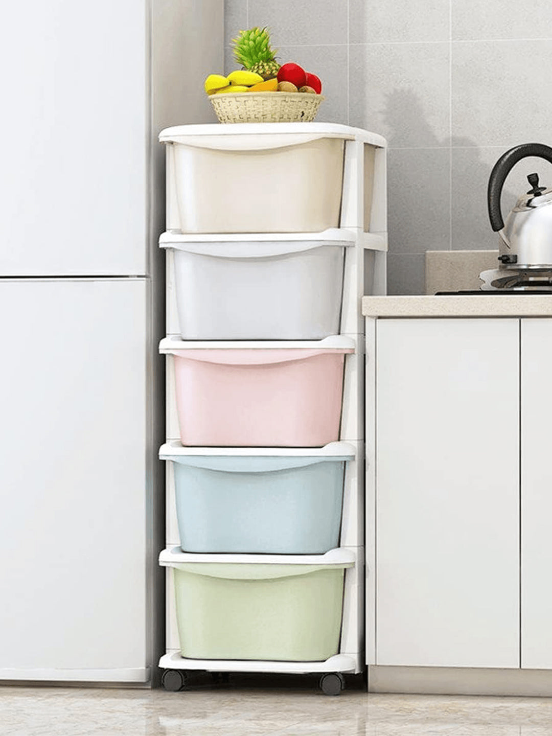 Multicolored storage bins on a rolling cart in a kitchen setting