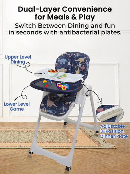 Children's high chair with adjustable plate and dinosaur pattern, used for meals and play.