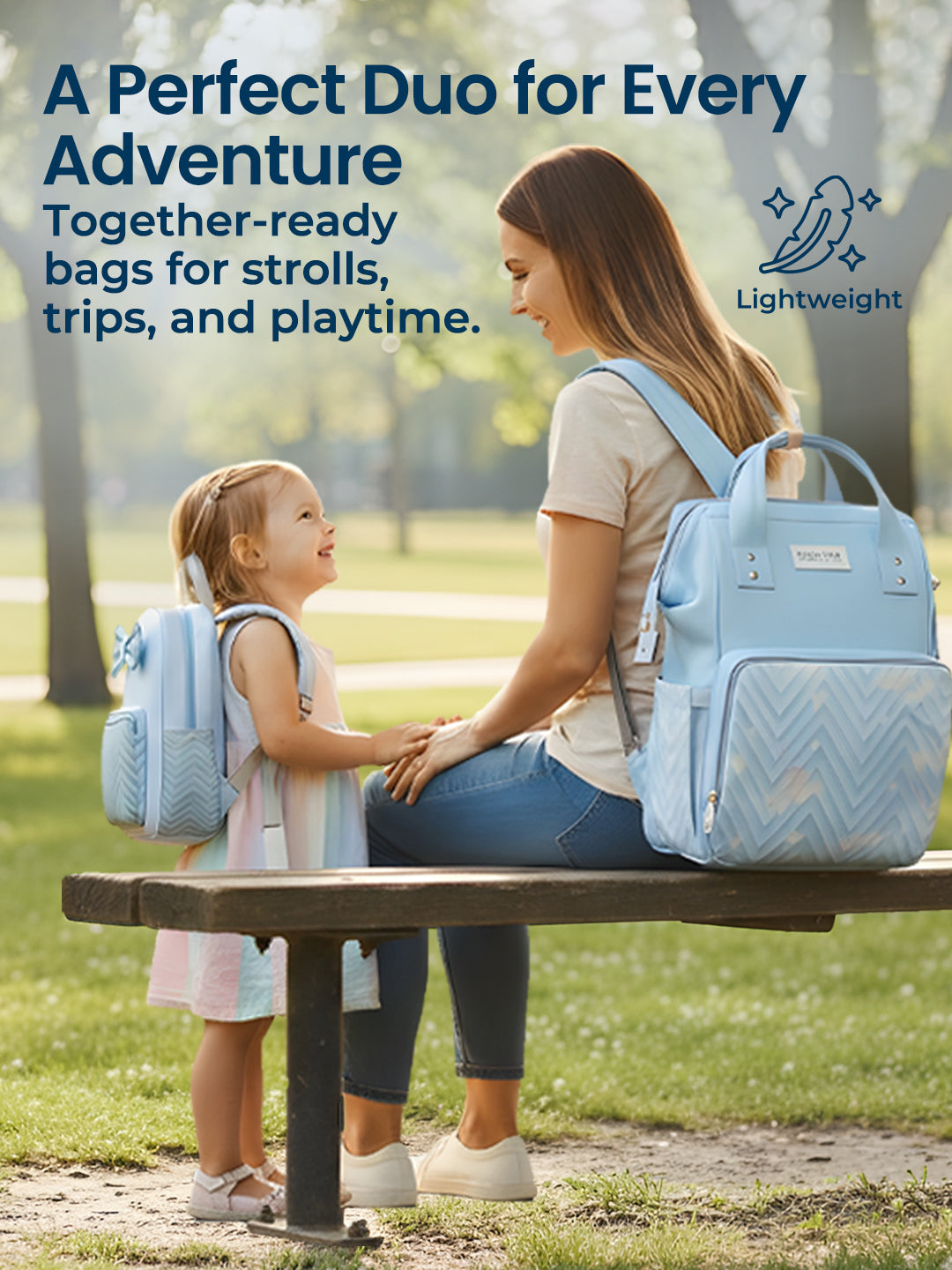 Woman and child sitting on a bench with matching blue backpacks, surrounded by trees and grass.
