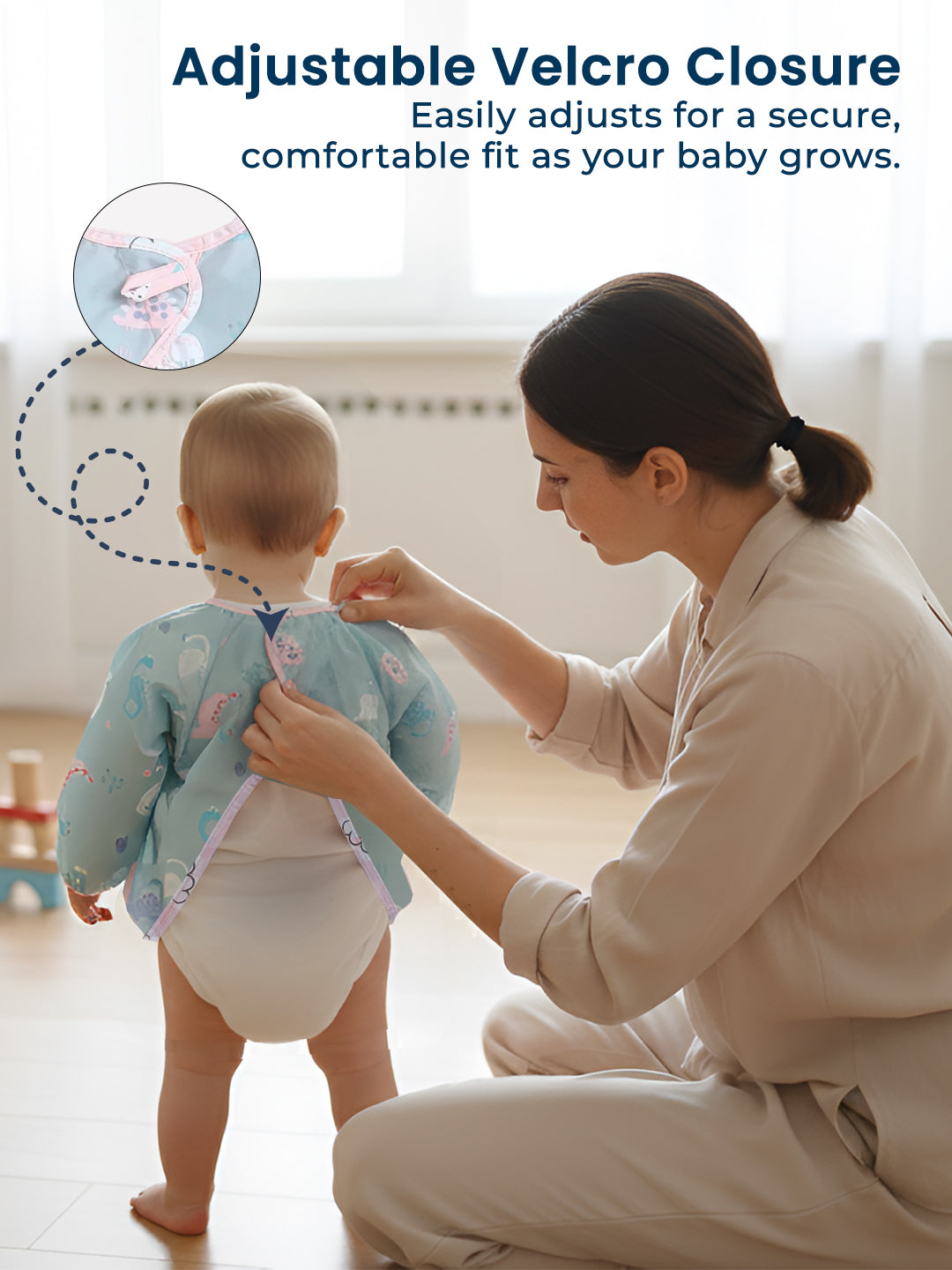 Woman adjusting a baby's outfit with text about adjustable velcro closure