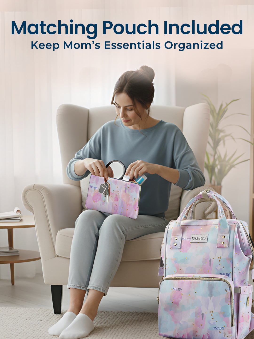 Woman sitting on a couch with a matching pouch and backpack, text 'Matching Pouch Included Keep Mom's Essentials Organized'.