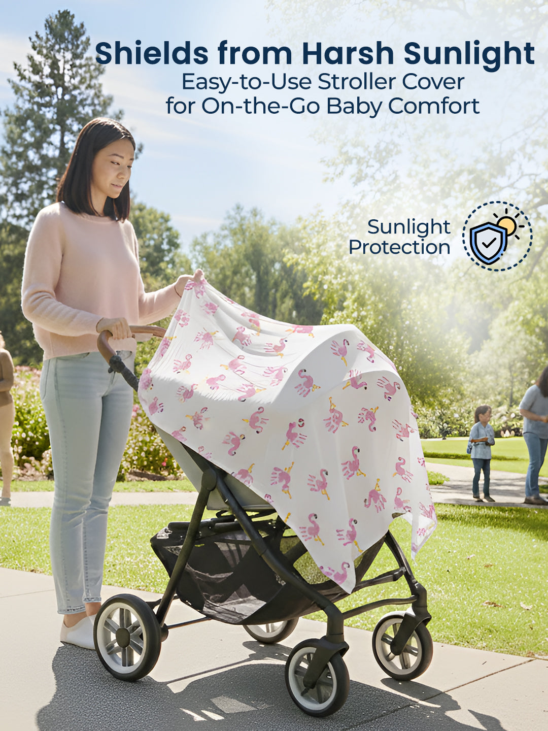 Woman using a stroller with a floral sunshade in a park setting, emphasizing sunlight protection.