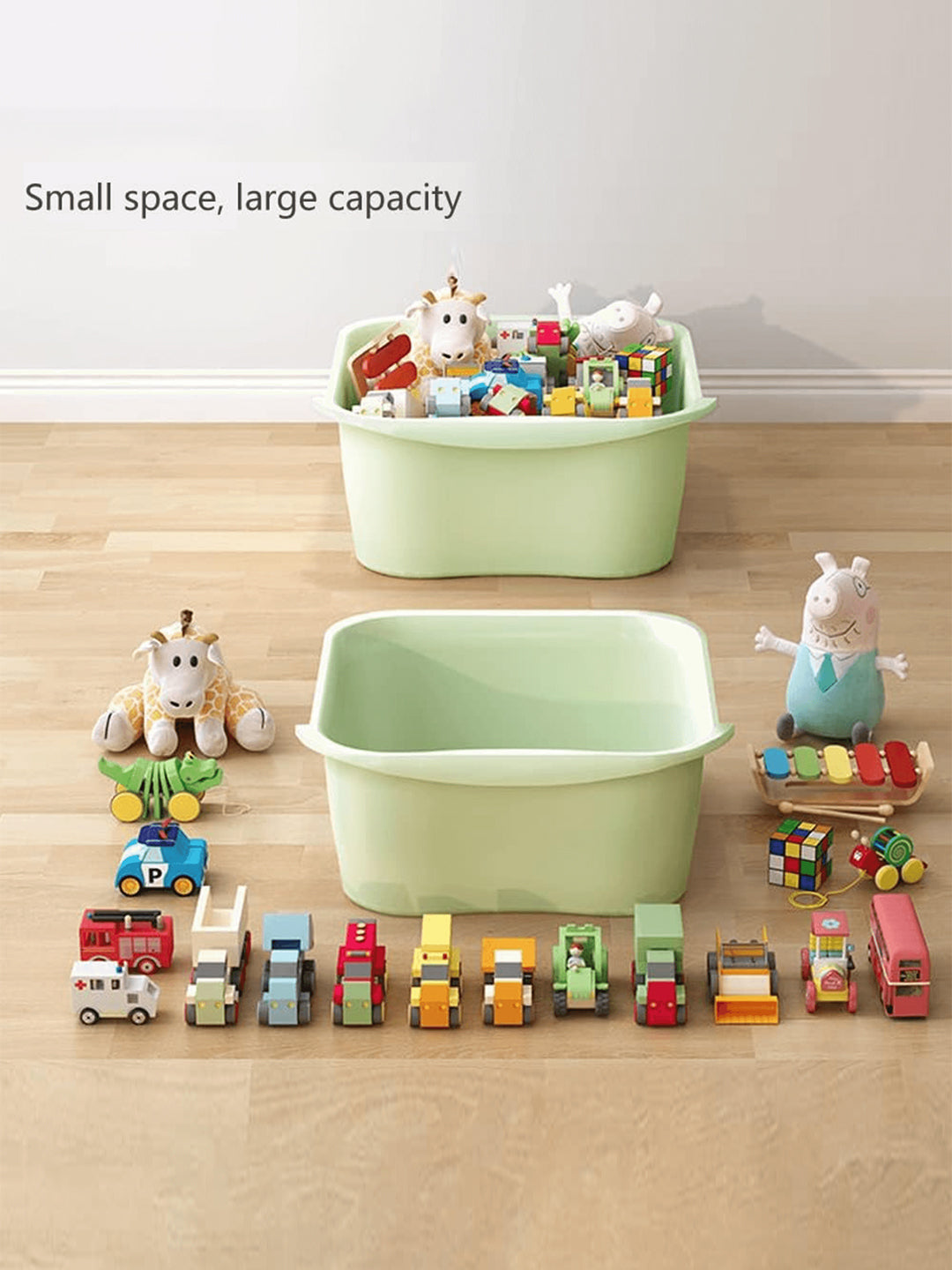 Two green storage bins filled with toys on a wooden floor.