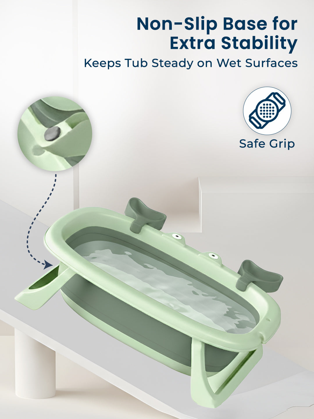 Green baby bathtub with non-slip base on a white background