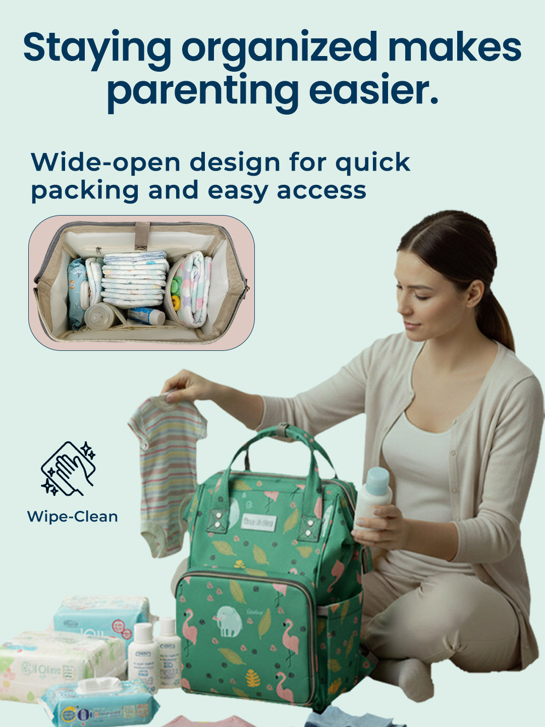 Woman organizing baby items with a green diaper bag, text about organization in parenting.