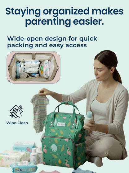 Woman organizing baby items with a green diaper bag, text about organization in parenting.