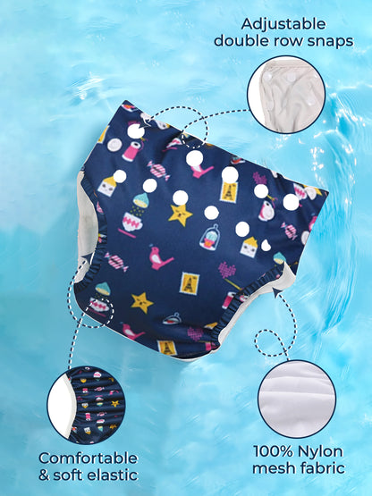 Navy swim diaper with colorful patterns on a blue water background, highlighting adjustable snaps and 100% nylon mesh fabric.