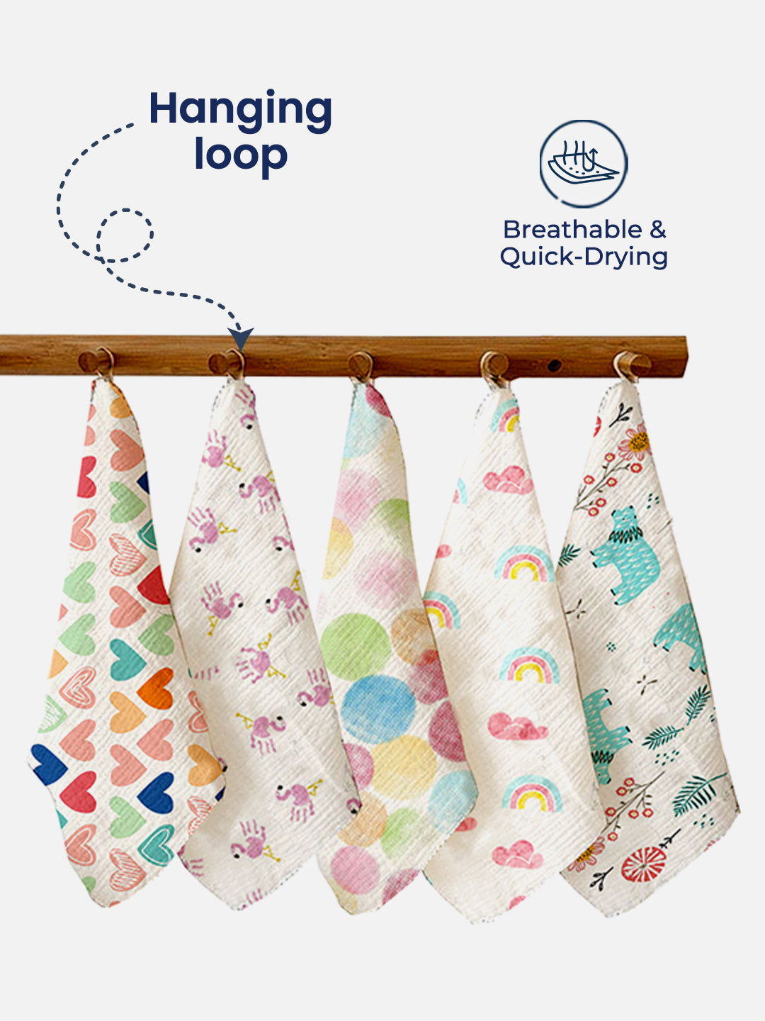 Set of colorful baby towels with patterns hanging on a rack, featuring text about breathability and quick-drying.