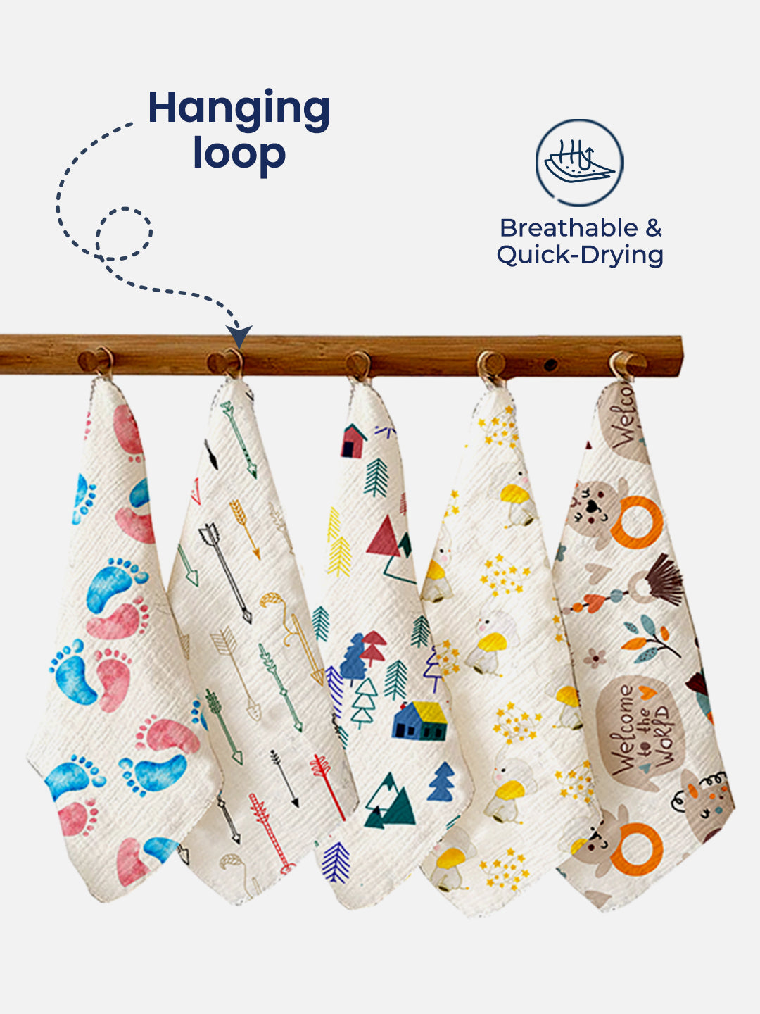 Set of colorful baby bibs with designs hanging on a wooden rack, featuring text about breathability and quick-drying.