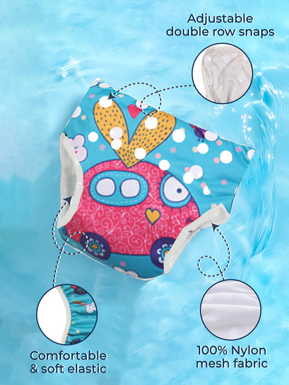 Baby diaper with owl design on a blue water background, featuring adjustable snaps and 100% nylon mesh fabric.