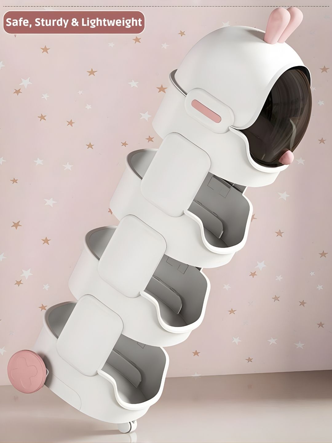 White and gray spiral toy with pink accents on a light pink background