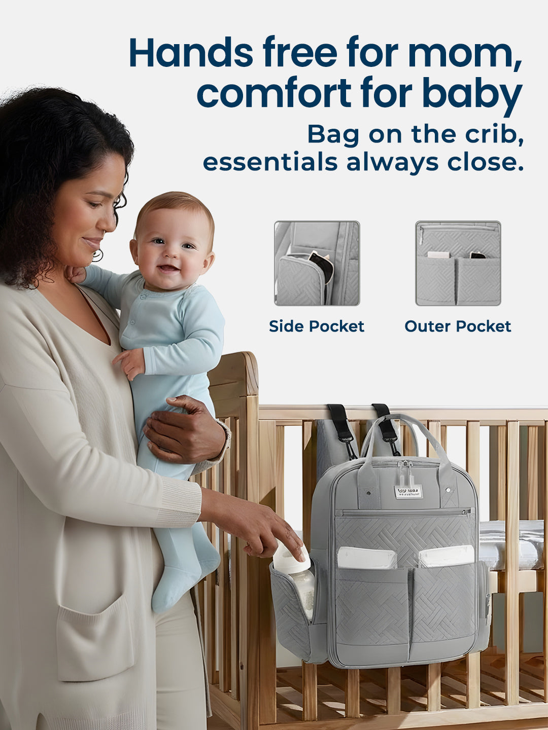Woman holding a baby next to a gray diaper bag with text about its features.