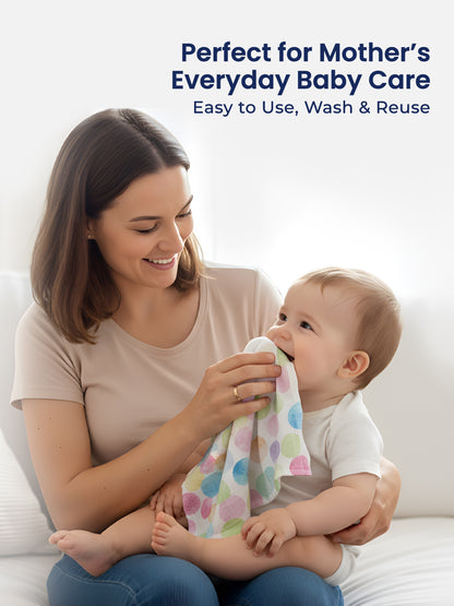 Woman holding a baby and a colorful cloth with text about baby care products.