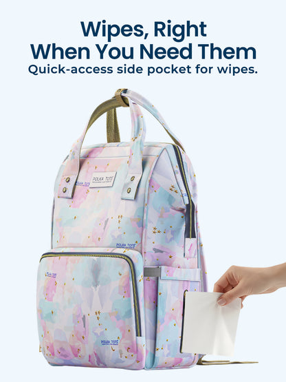 Multicolored backpack with a quick-access side pocket for wipes, featuring text 'Wipes, Right When You Need Them'.