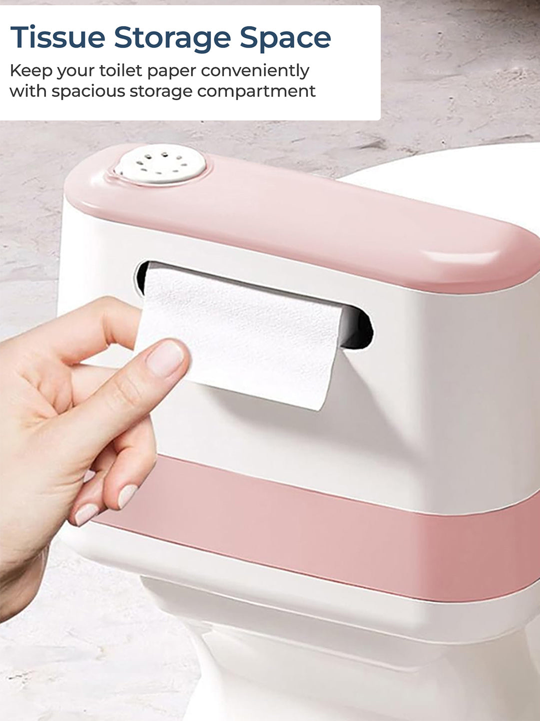 Pink and white tissue holder with a hand pulling out a roll of toilet paper.