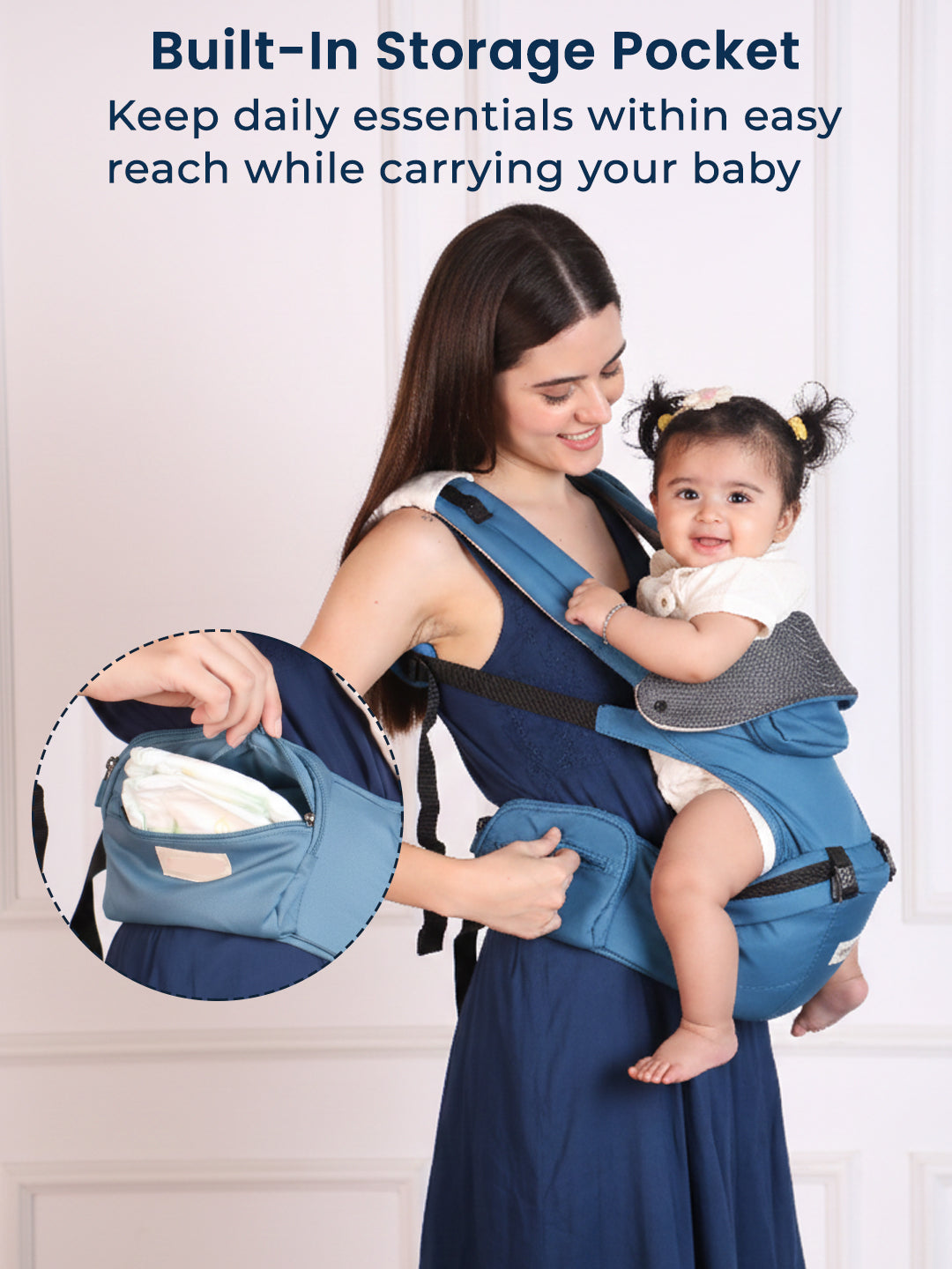 Woman using a baby carrier with a built-in storage pocket, holding a baby.