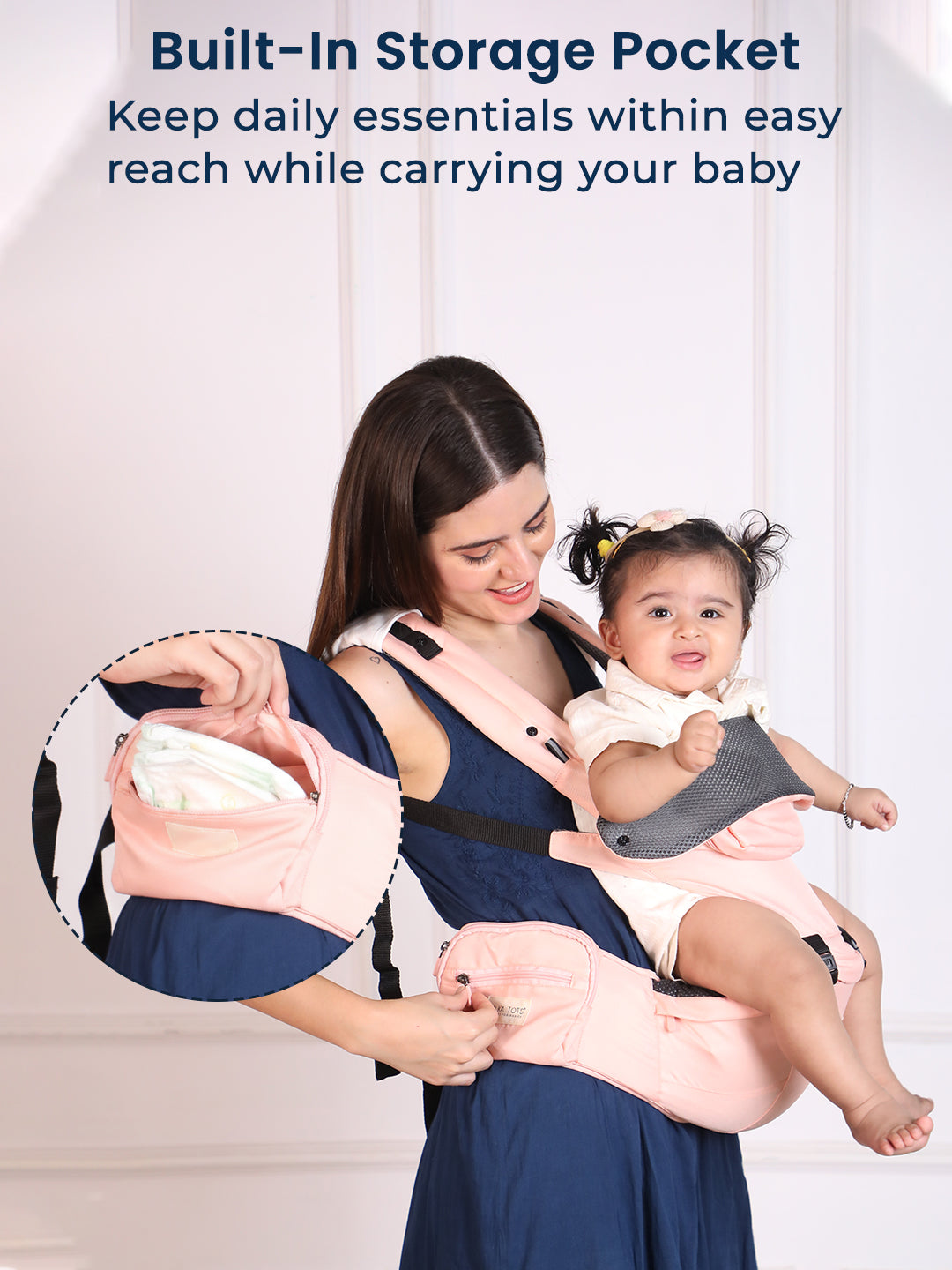 Woman using a baby carrier with a built-in storage pocket, holding a baby.