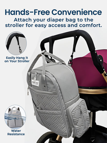 Gray diaper bag attached to a stroller with text highlighting features like hands-free convenience and water resistance.