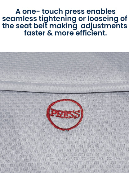 Close-up of a seat belt with a 'PRESS' button on a gray background