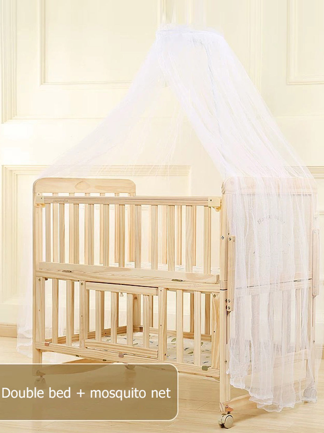 Wooden crib with a mosquito net in a room with light-colored walls.