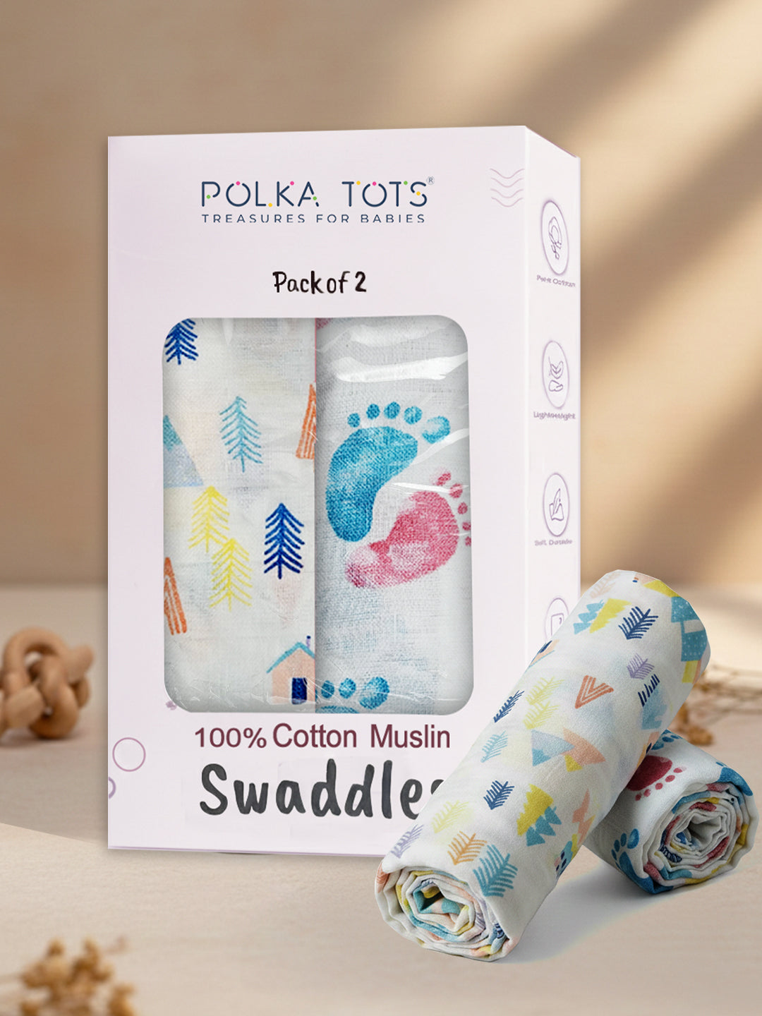Polka Tots 100% Cotton Muslin Swaddles packaging with swaddles on a beige background