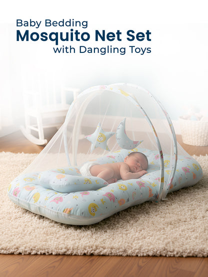 Baby bedding mosquito net set with dangling toys on a wooden floor.