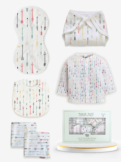 Baby product set with bib, burp cloth, and diaper on a white background