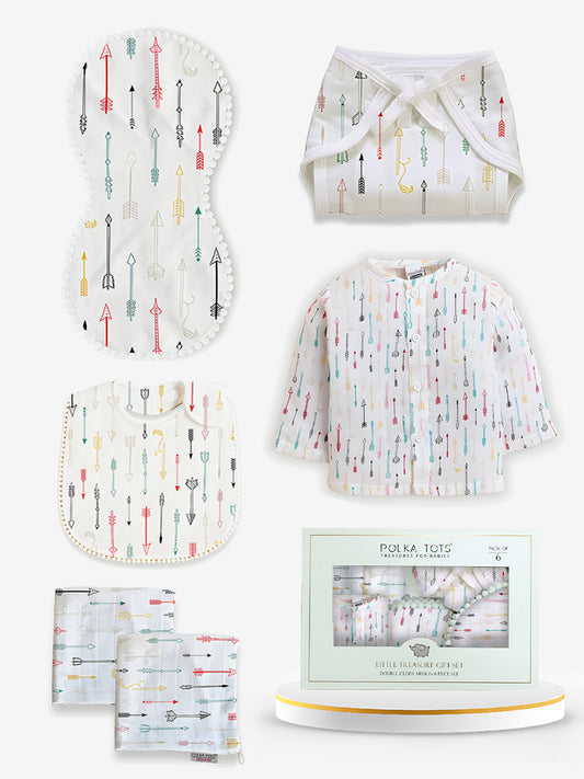 Baby product set with bib, burp cloth, and diaper on a white background